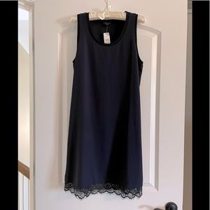 Ann Taylor navy sleeveless tank dress with lace trim bottom. Size S